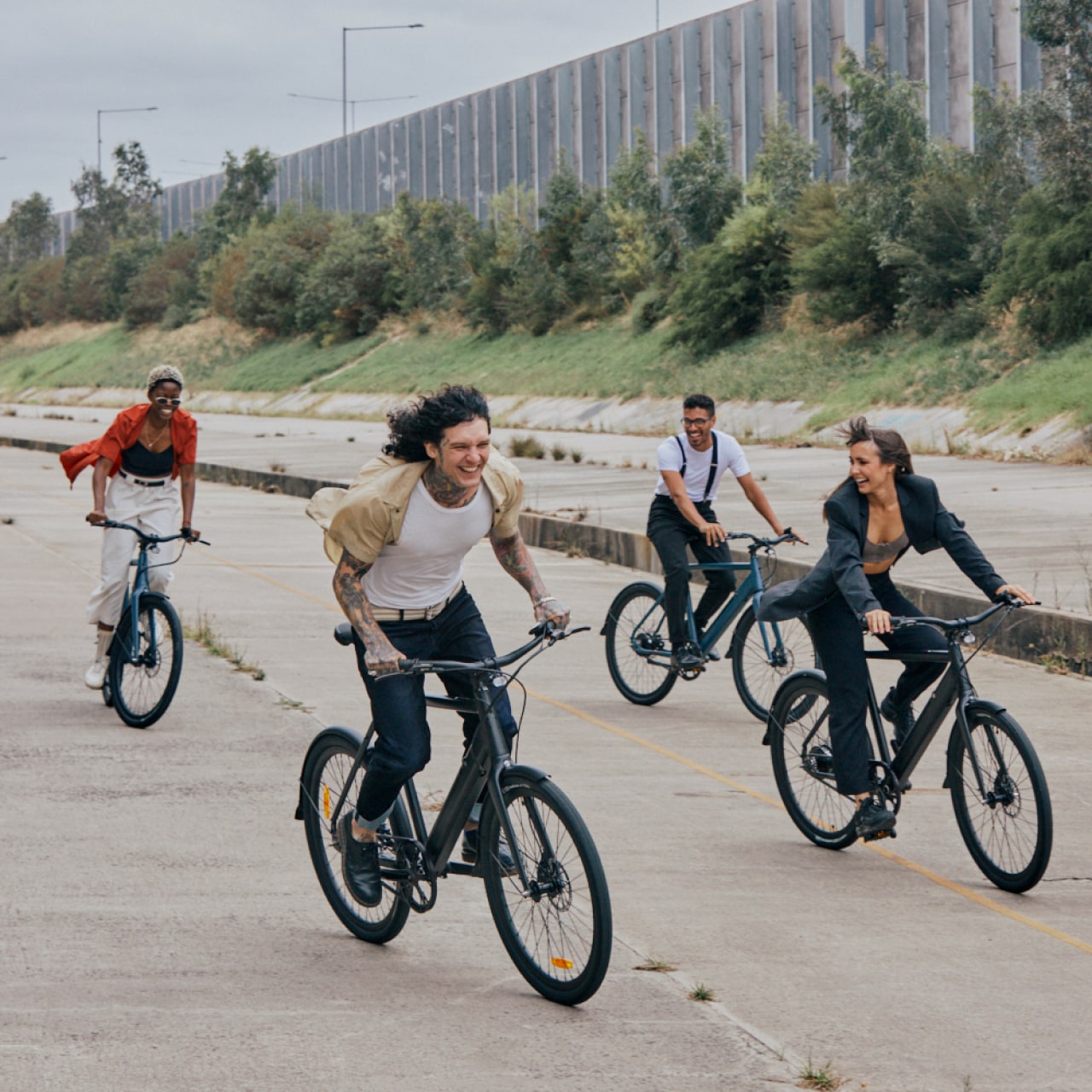 Friends biking on Amsterdam plus ebikes