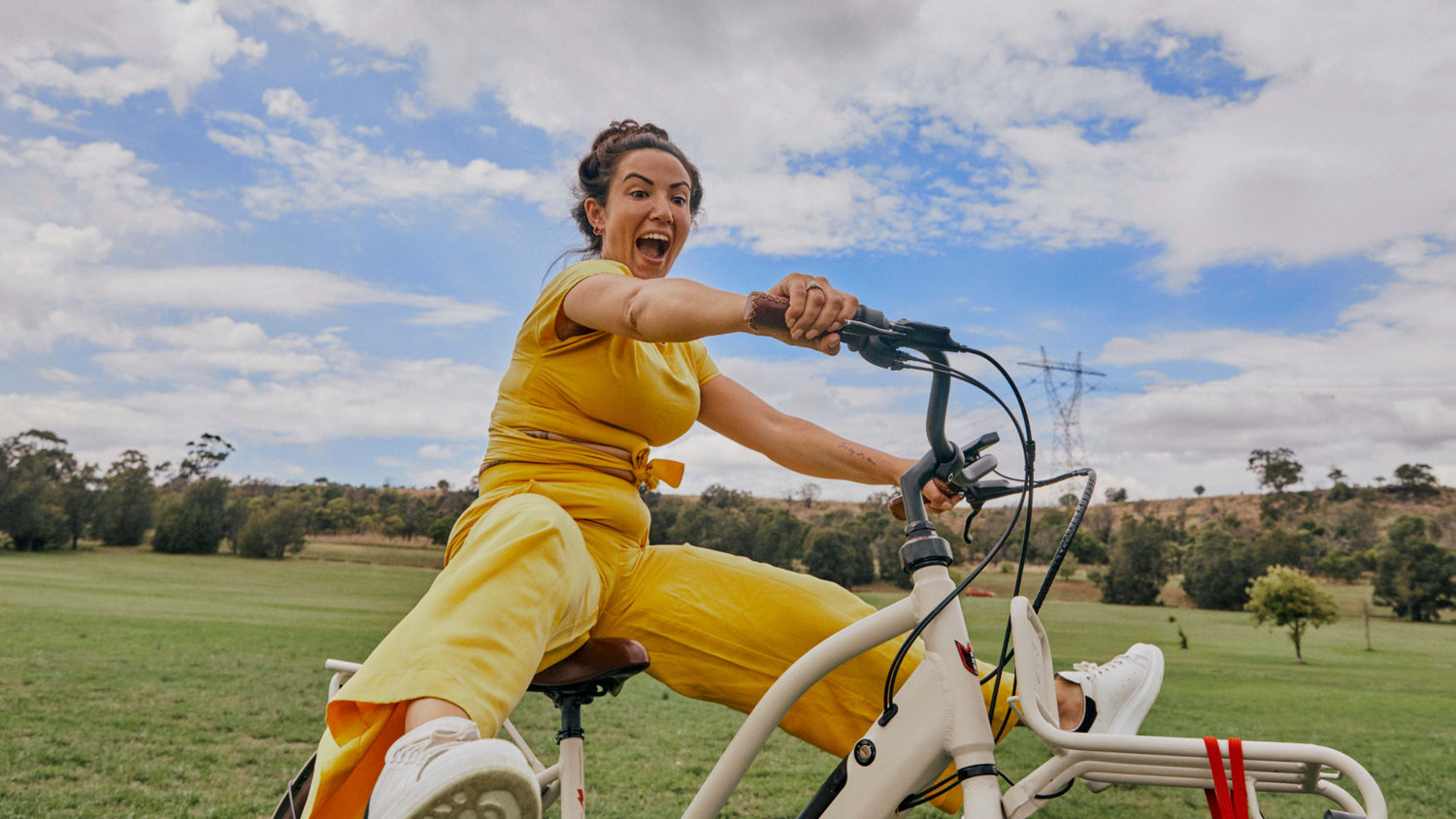 Happy woman with Jordaan GT eBike in park Happy woman with Jordaan GT eBike in park