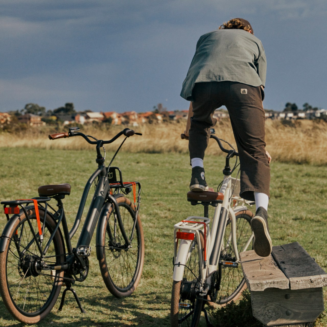 Man jumping on his Lekker Bike Jordaan GT ebike in the park Man jumping on his Lekker Bike Jordaan GT ebike in the park