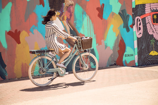 Woman cycling on Jordaan eBike Lekker Bike